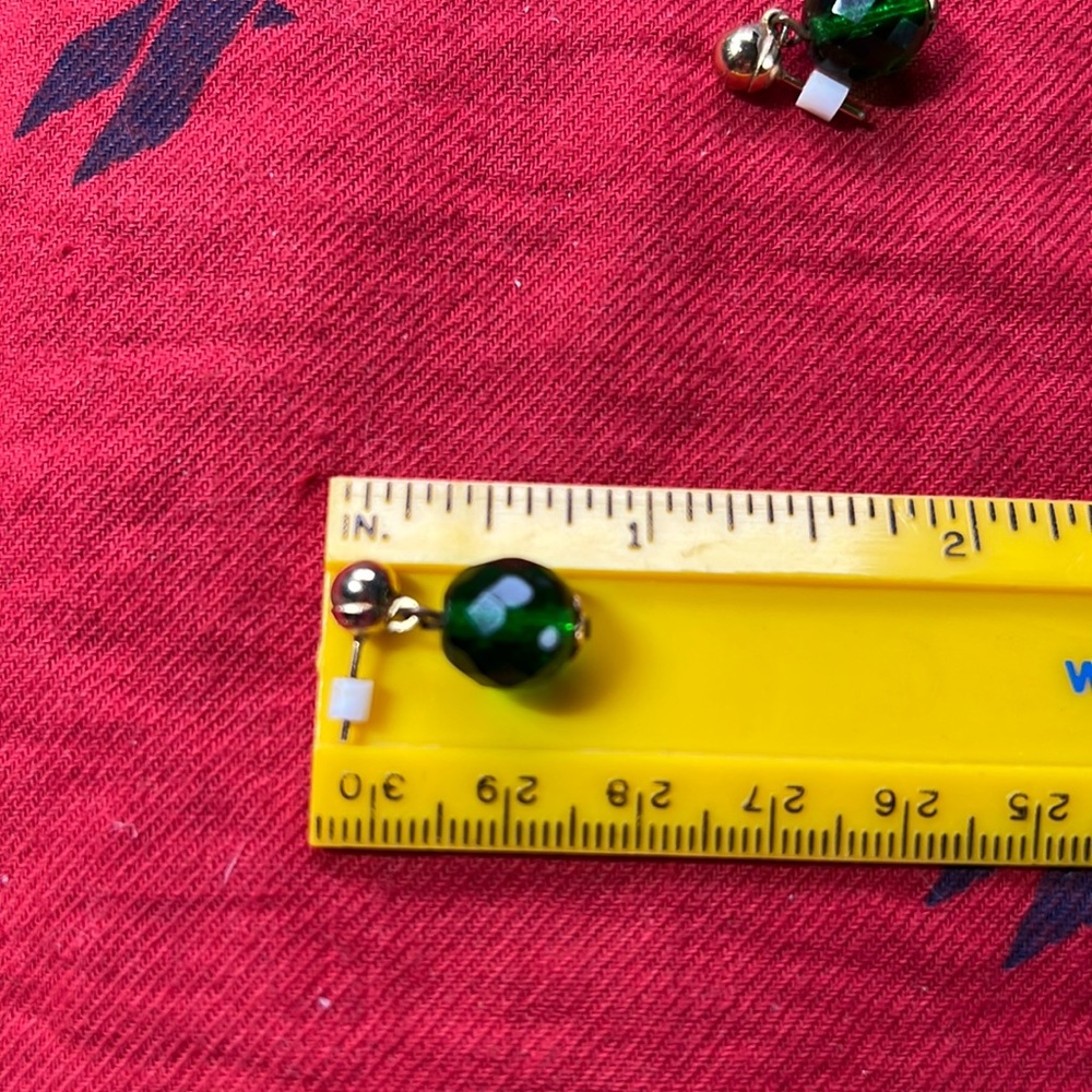 Small back post gold tone earrings with a small dangling ball